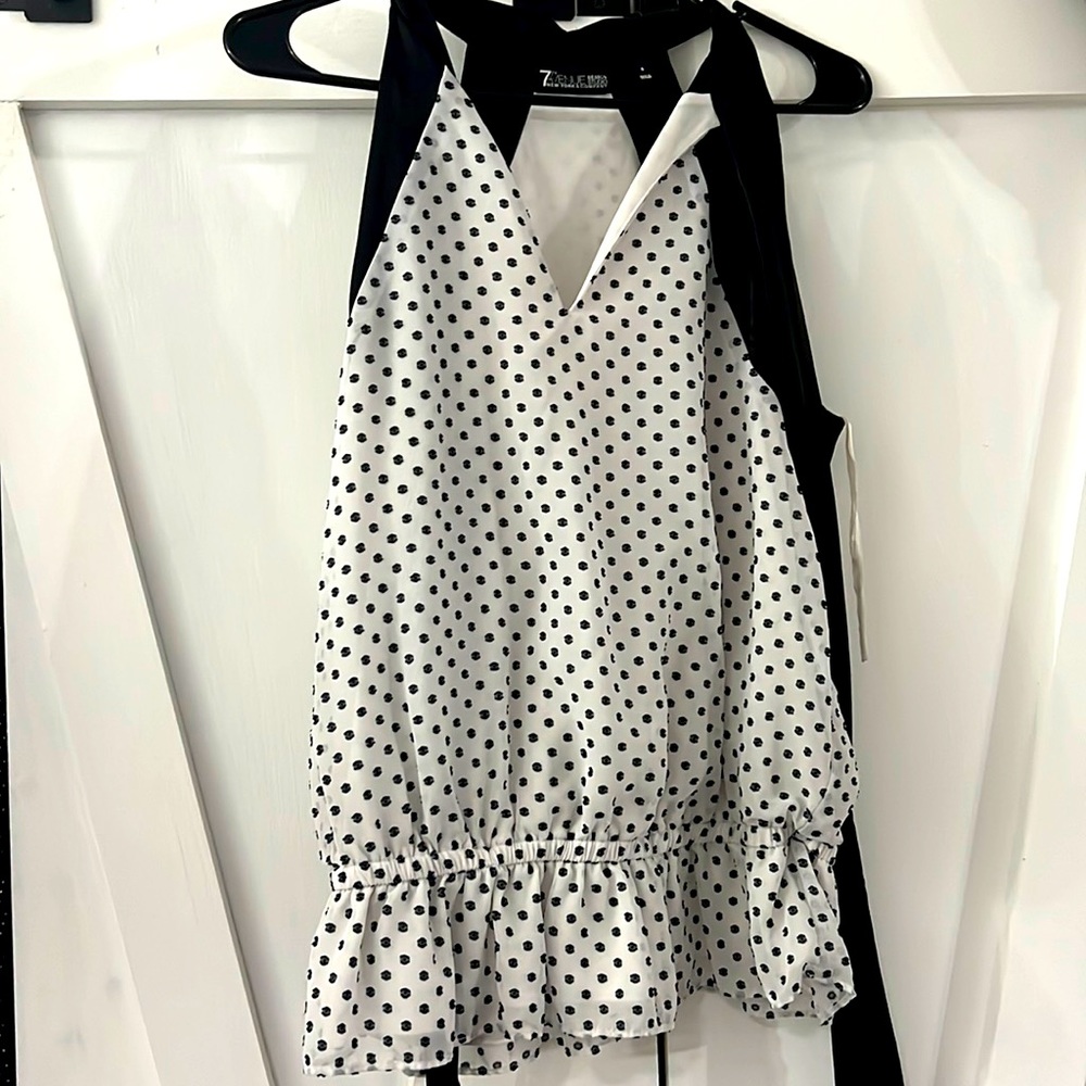 Black and white polka dot short sleeved blouse size small.